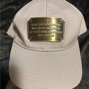 Walt Disney parks gray entrance plaque here you leave today hat cap